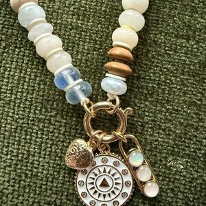 Anthropologie Gold and Cream Charm Necklace. NWT